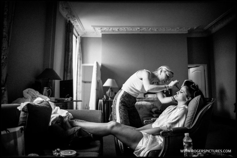 Bridal Preparation-01 Relaxed bride has makeup applied before the wedding