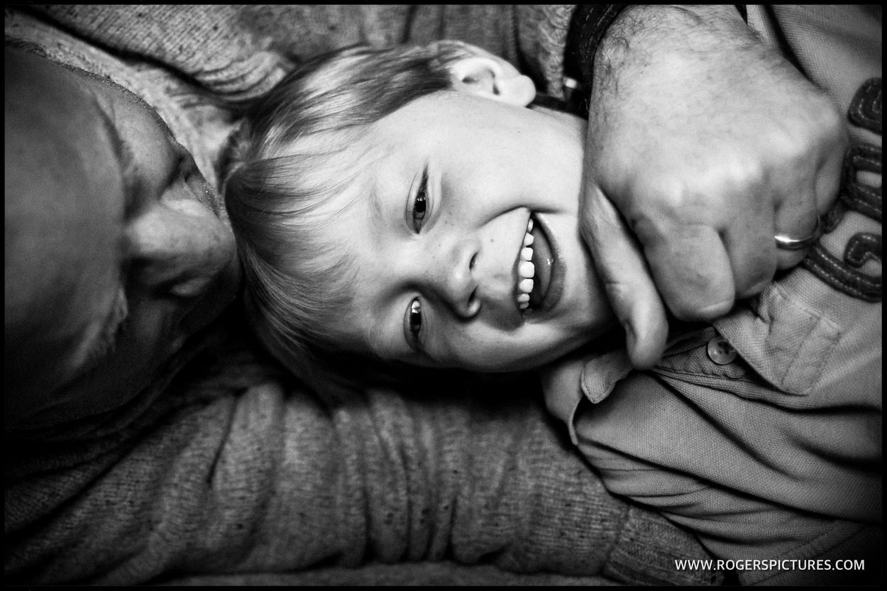Dad tickles his son