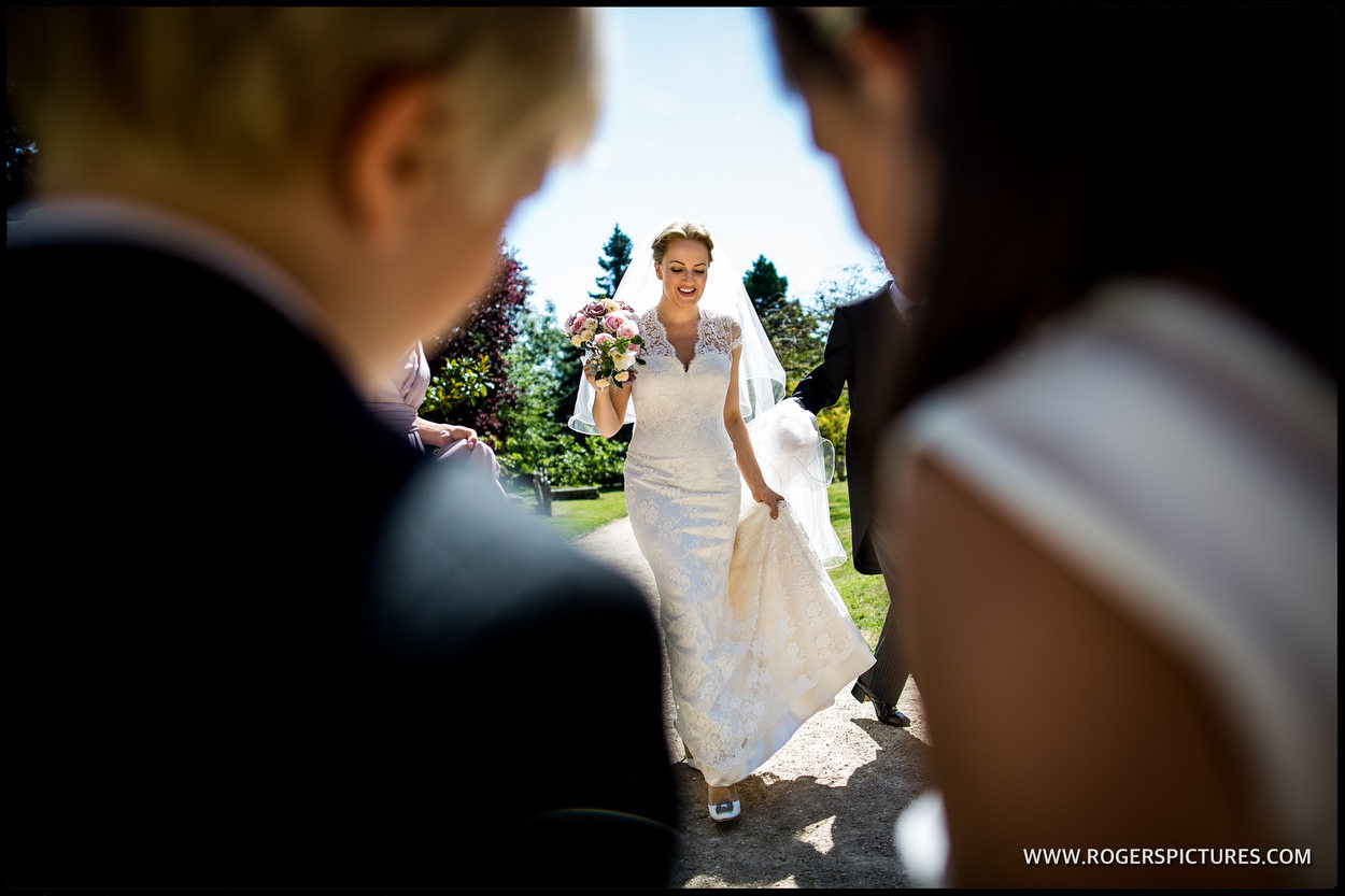 A bride arrives at Boxgrove Priory in Sussex