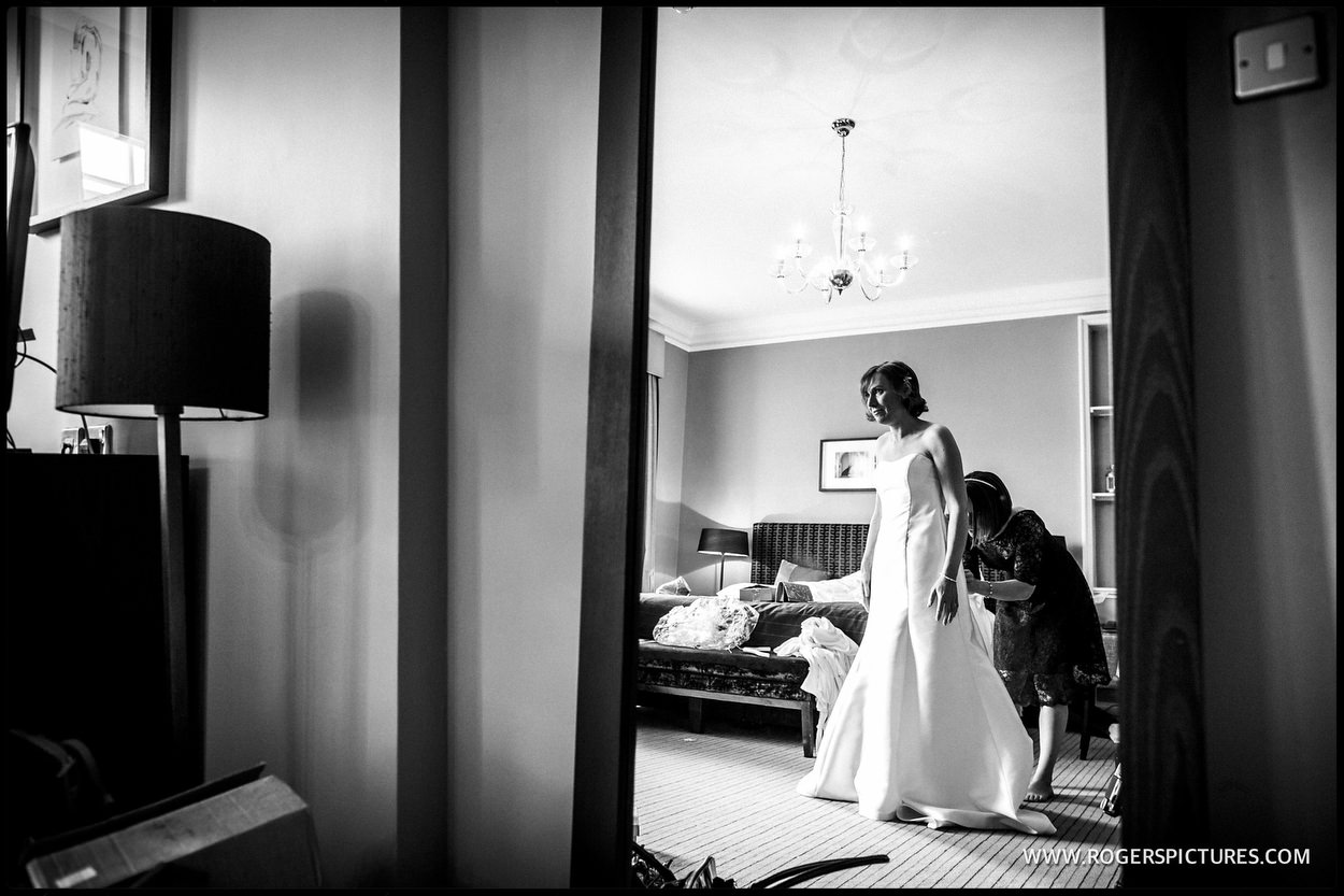 Bride framed in a doorway at Gorse Hill before getting married