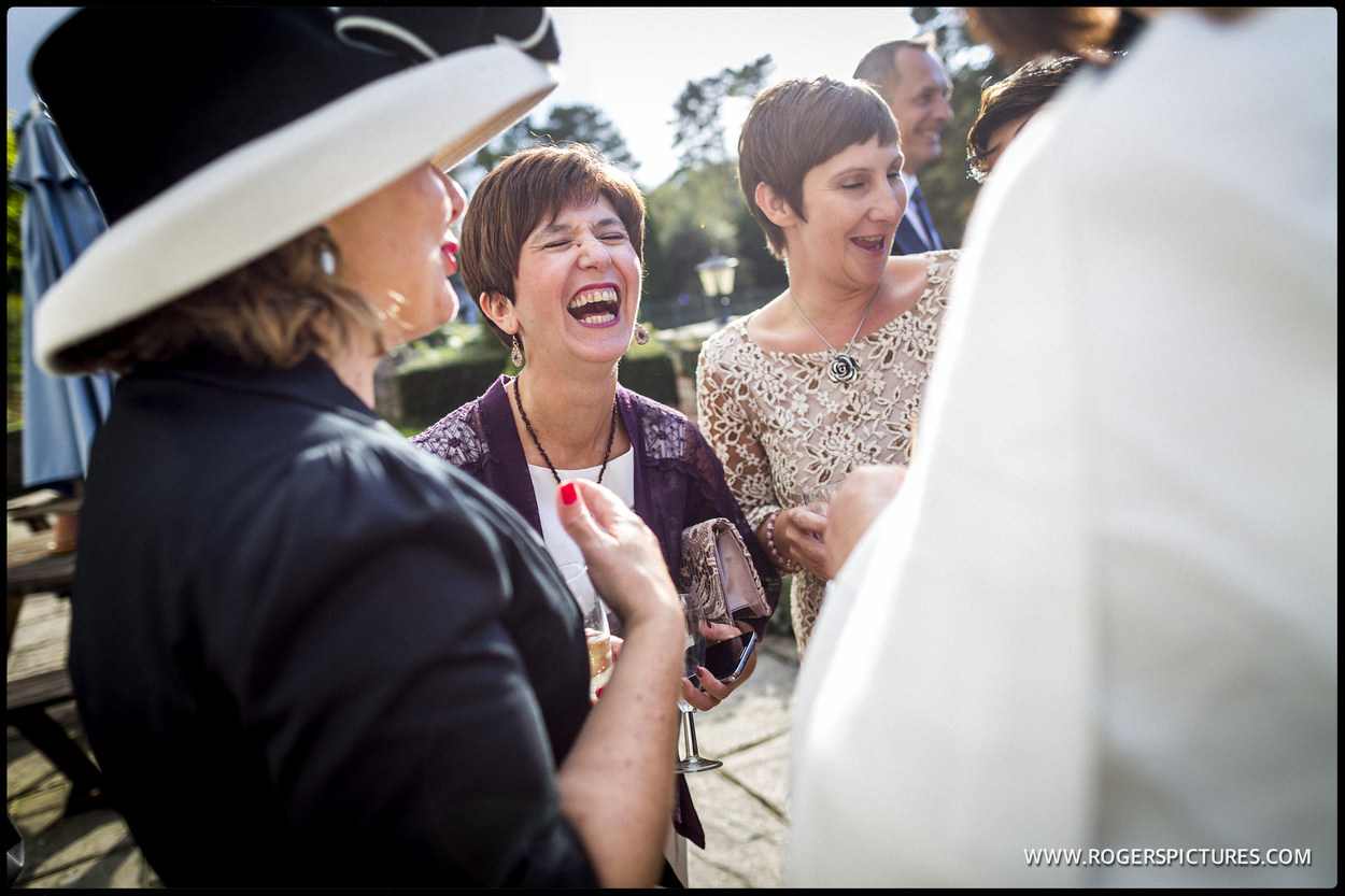 Laughing guests at a wedding 