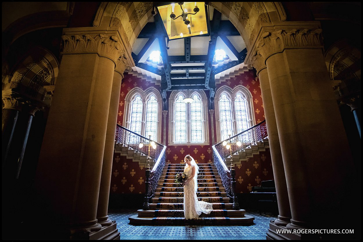 Bride on Spice Girls wannabe staircase at St Pancras Hotel London