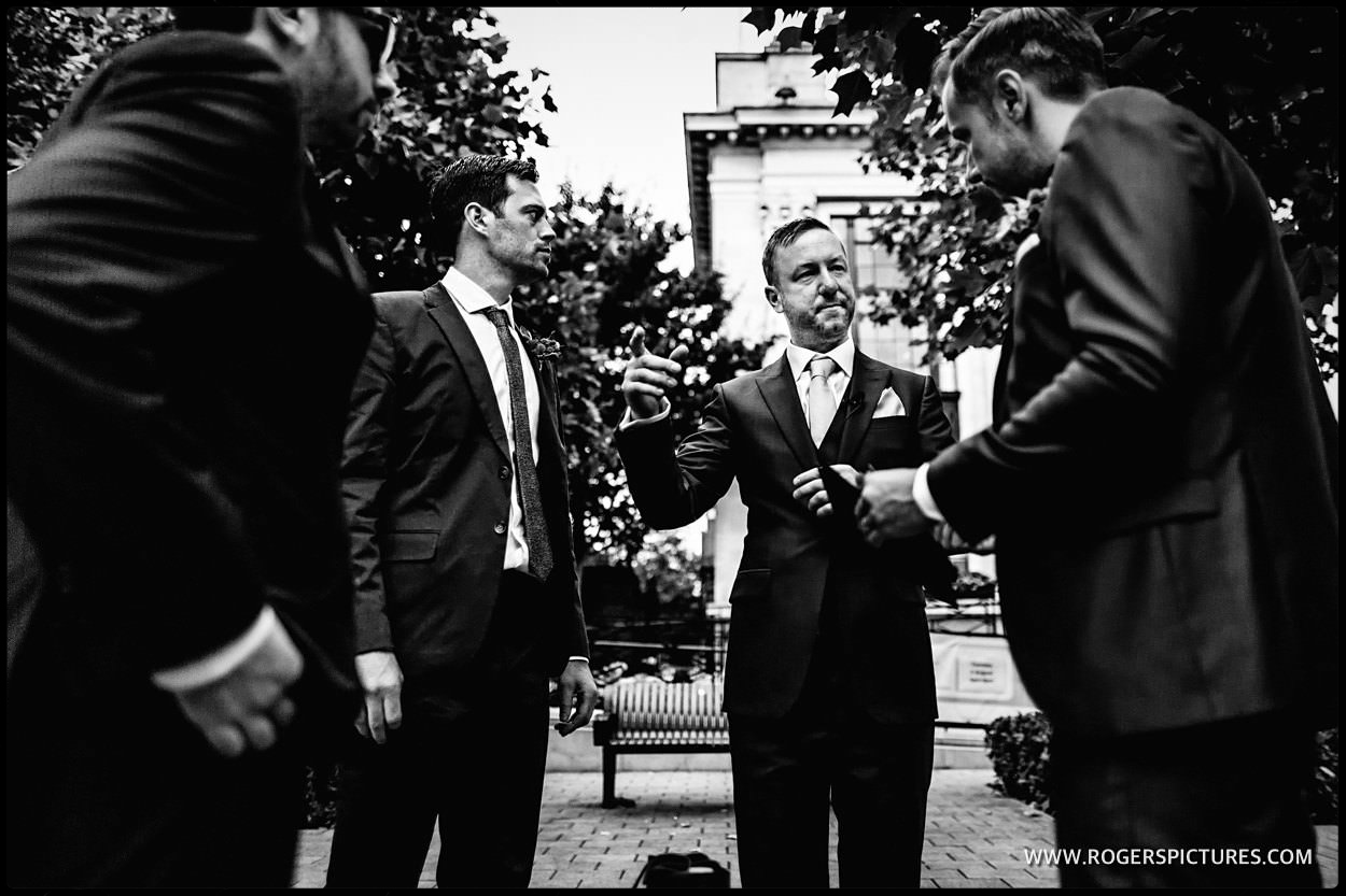 Groom and groomsmen outside Islington town Hall