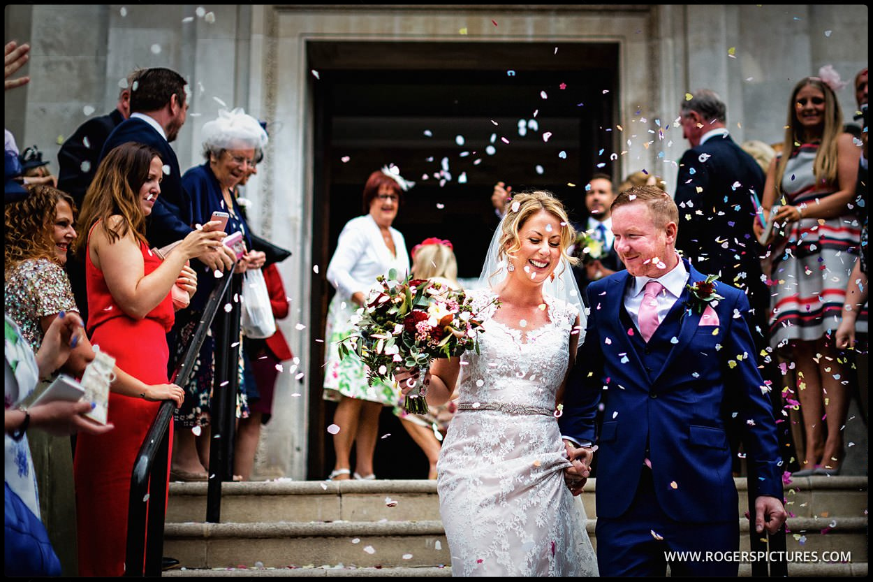 Documentary photograph of bride and groom outside Islington town Hall