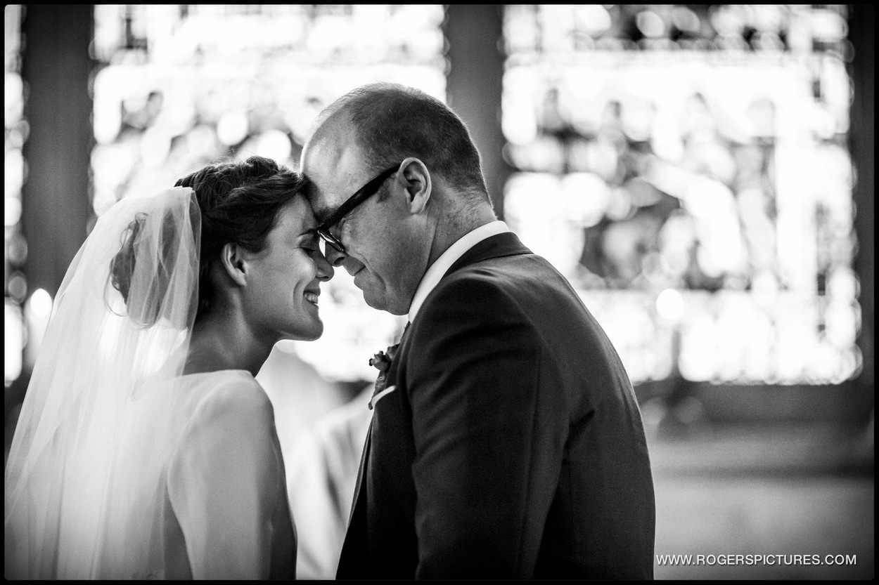 Black and white photo pf bride and groom at St Etheldreda’s Church Wedding