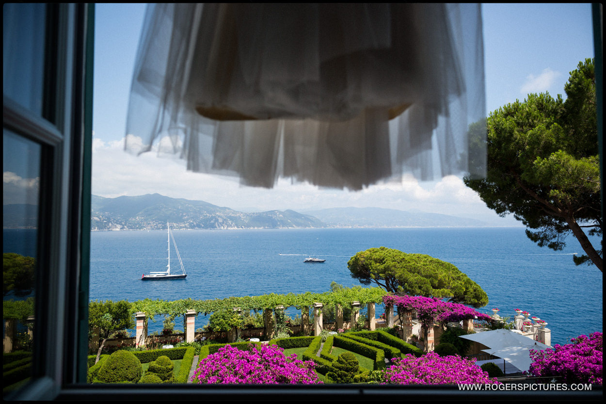 Wedding dress hanging in front of Portofino