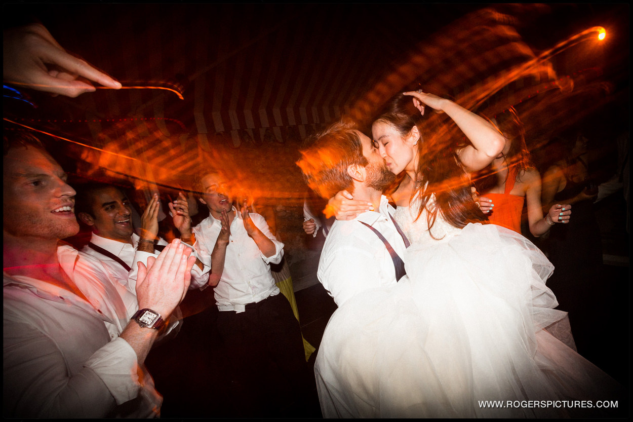 Husband-and-wife celebrate on the dance floor after marrying in Portofino Italy