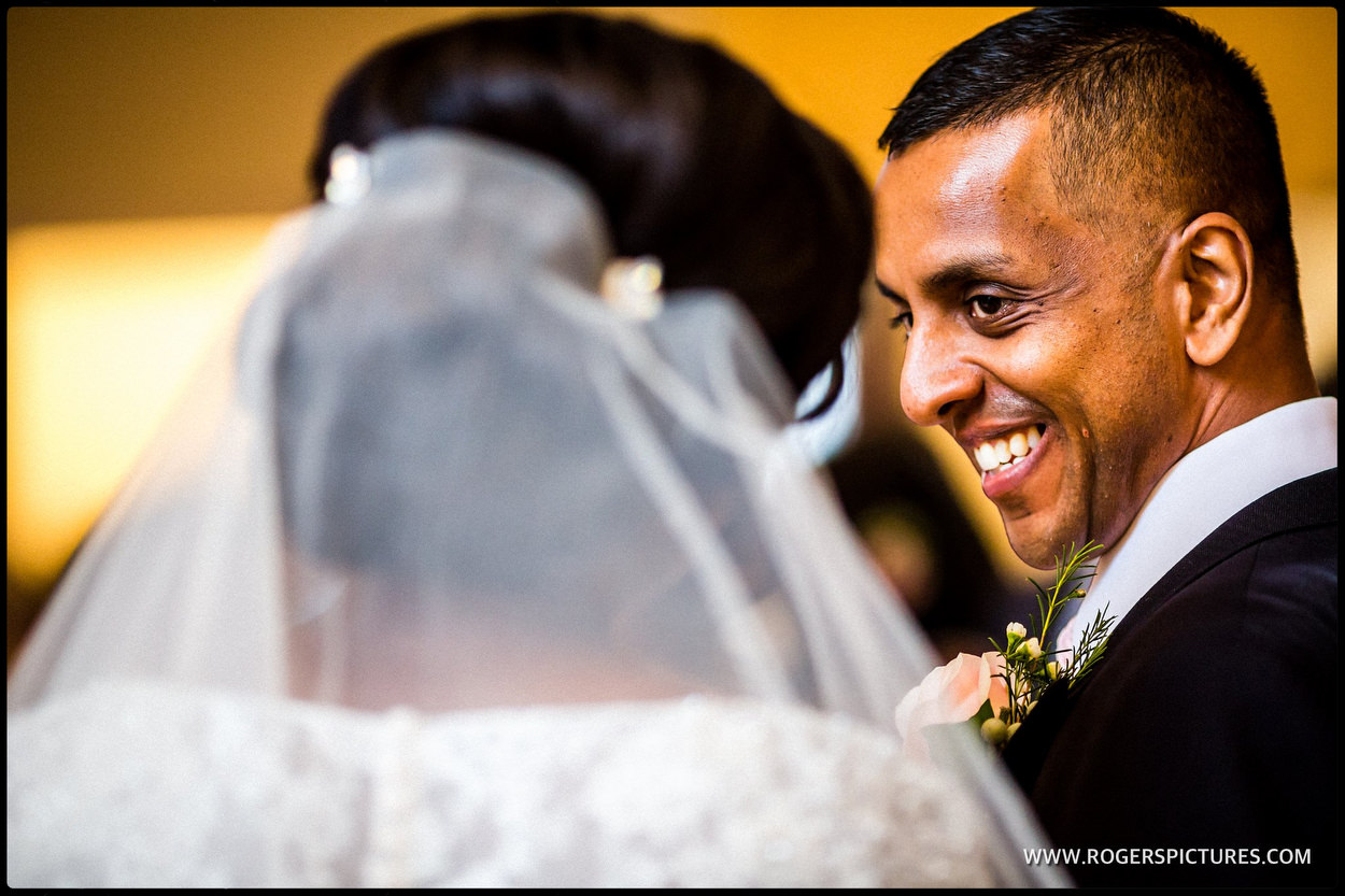 Smiling groom as he gets married