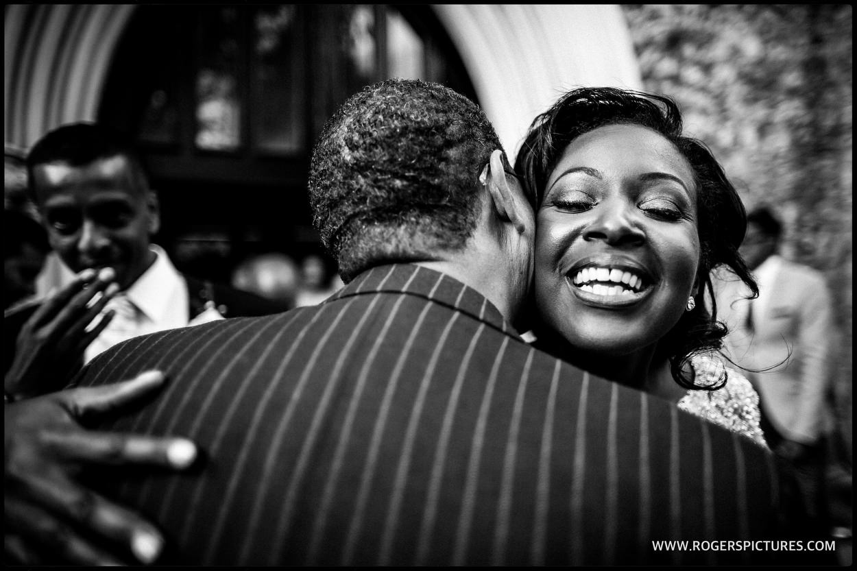 Bride is congratulated by guests outside the church