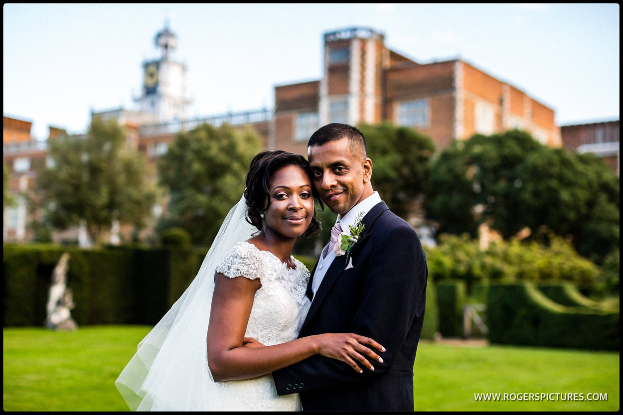 Bride and groom outside the old Palace at Hatfield house