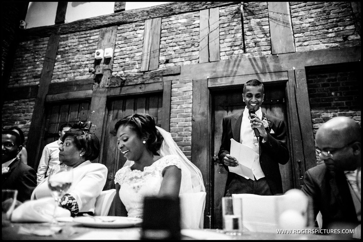 Groom speaking during wedding breakfast at Hatfield house