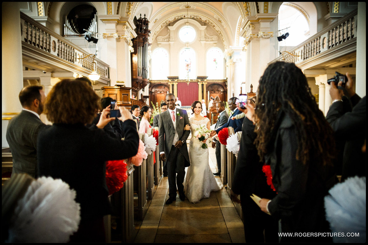 Bride and groom recessional at church in North London