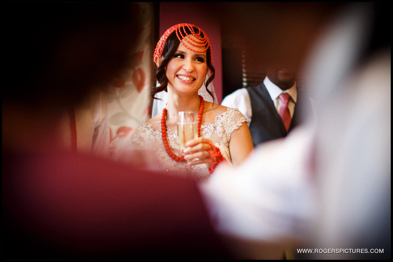 Smiling bride with a glass of champagne