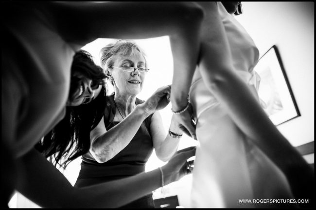 Book A Photojournalist For Your Wedding Wedding Photojournalist photographing bridal preparation