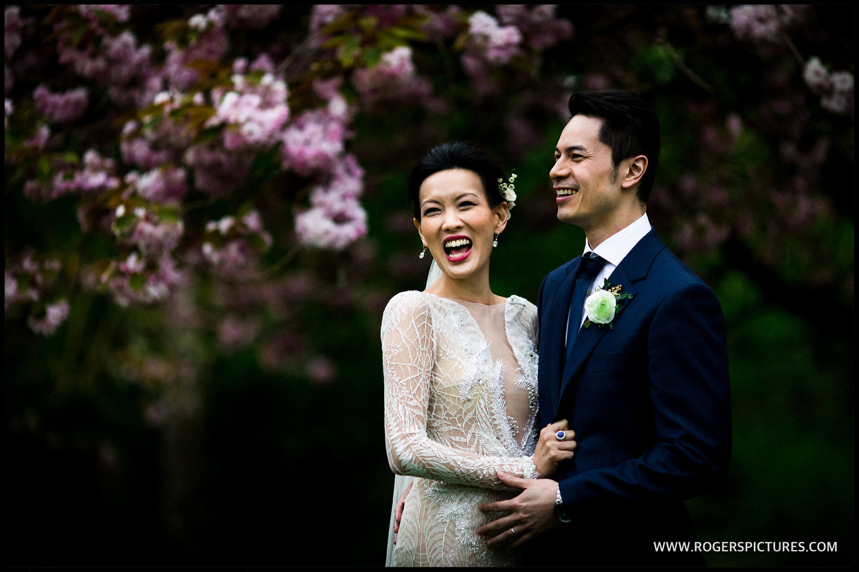 Wedding portrait in front of blossoms at Babington House