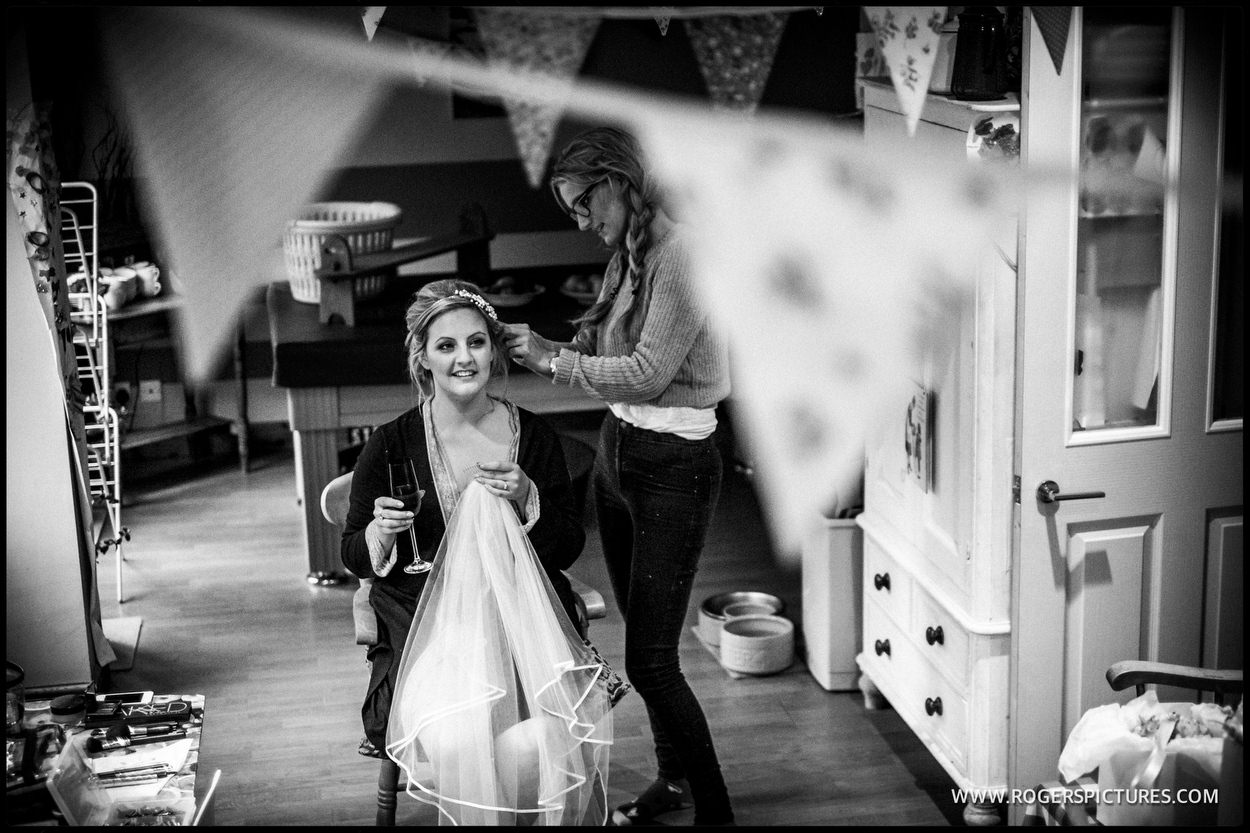 Bride preparation with a glass of champagne