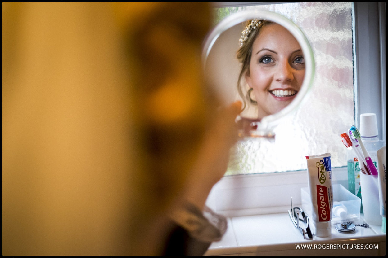 Brides reflection on the circular mirror