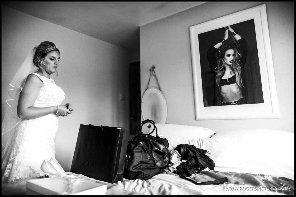 Black and white photo of a bride getting ready for the wedding