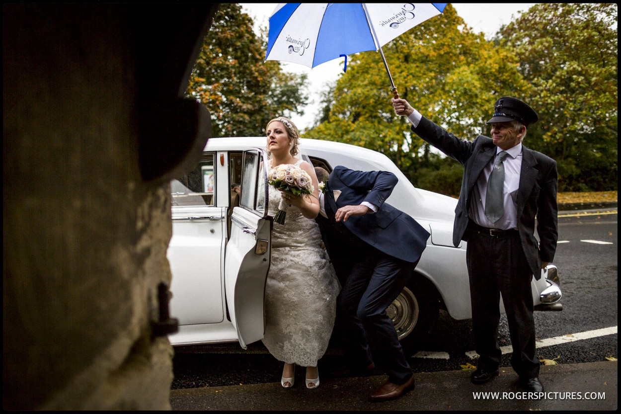 Bride arrives in the rain