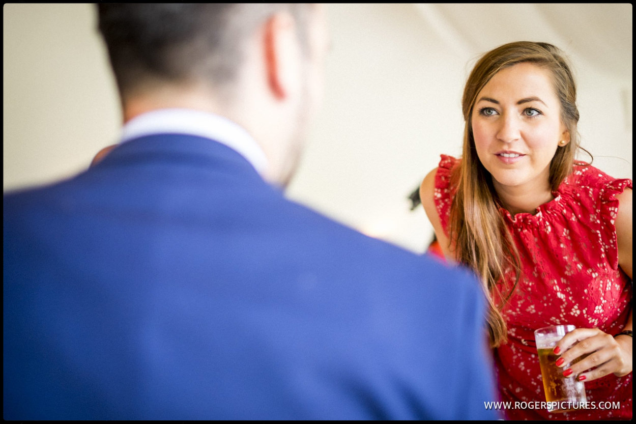 Wedding guest in a red dress