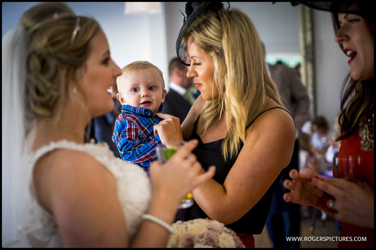 Guest with baby at wedding