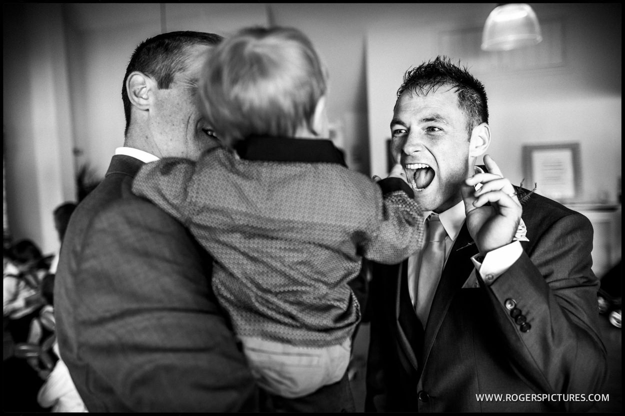 Guests laughing at wedding ceremony