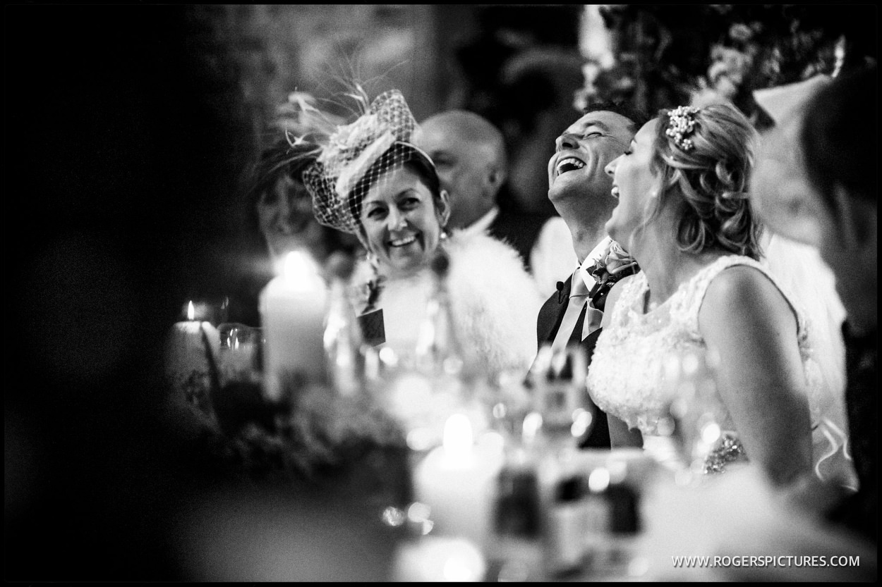 Black and white wedding picture of Mother enjoying speeches