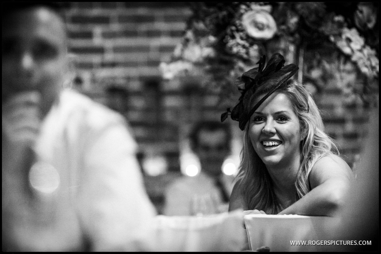 Guests listen to wedding speeches