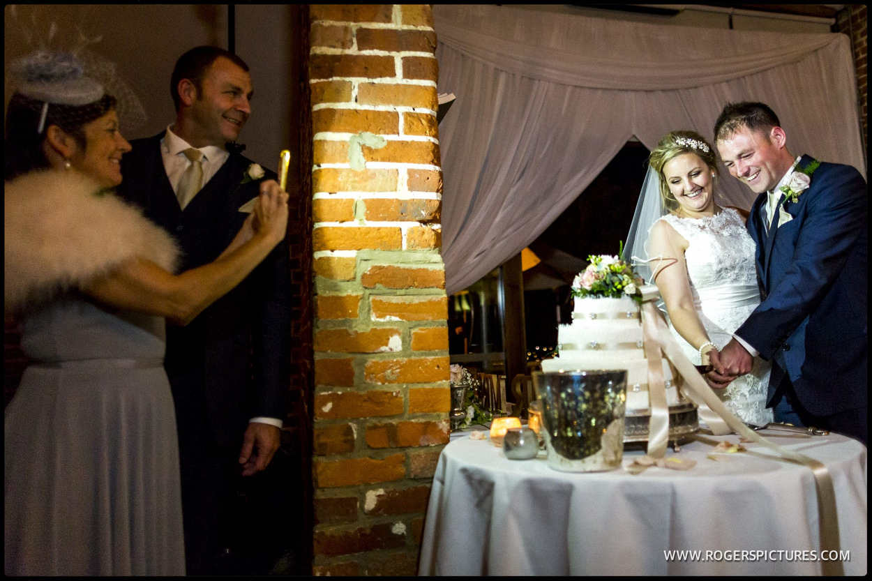 Couple cut the wedding cake