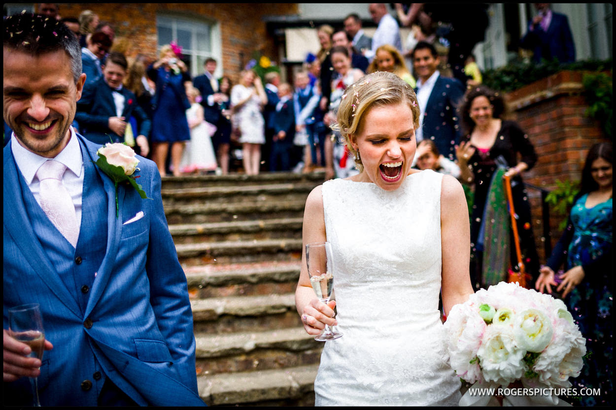Laughing bride after getting married in St Albans