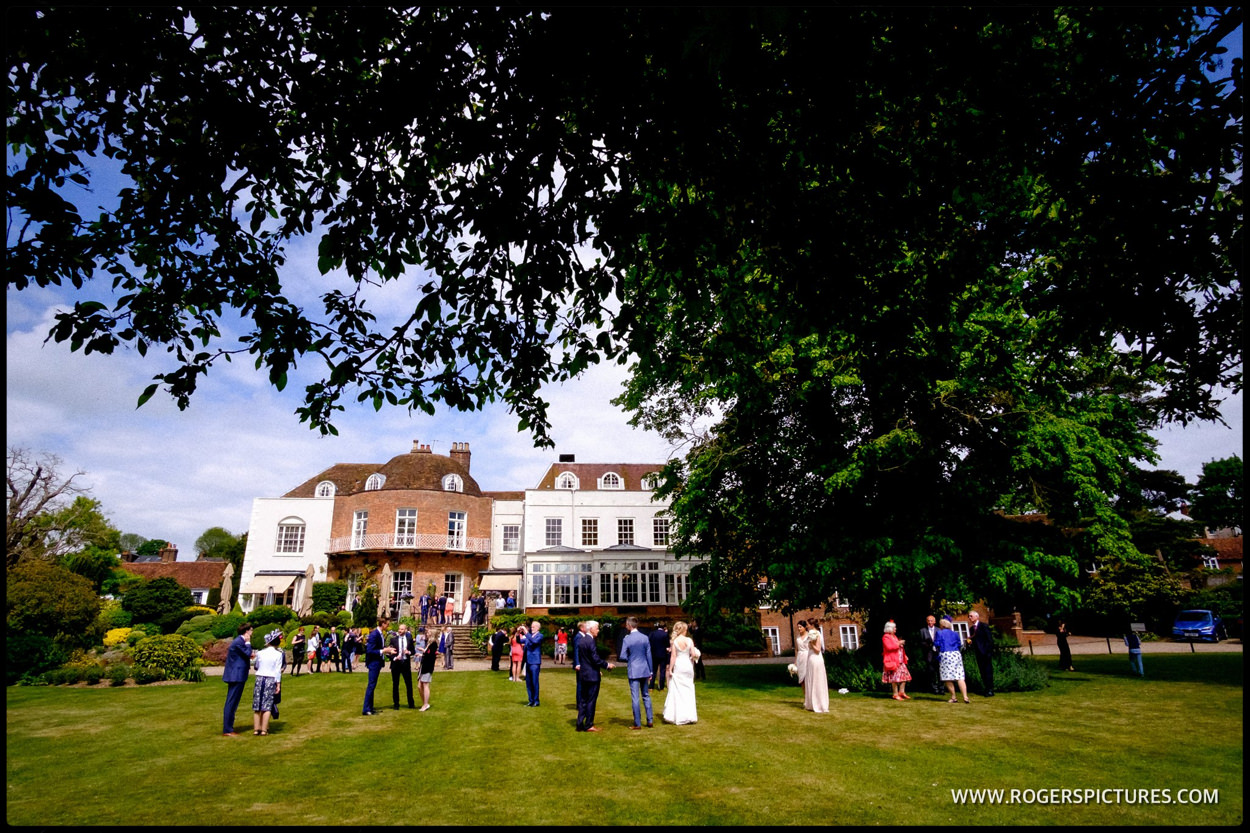 Guests outside St Albans Hotel wedding