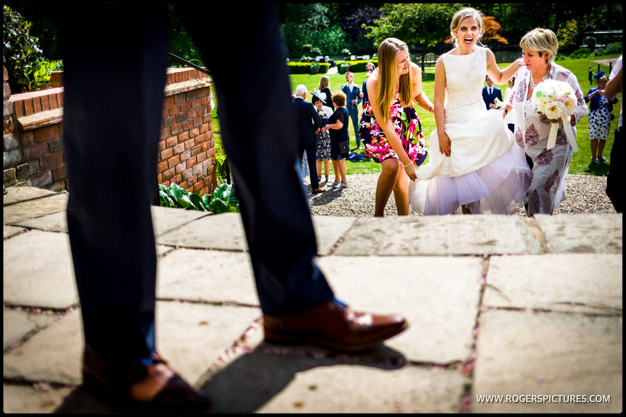 Bride walking up steps at hotel