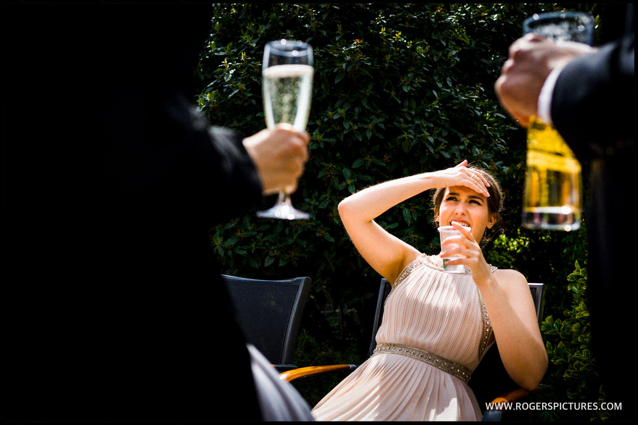 Wedding guest outside in the sun