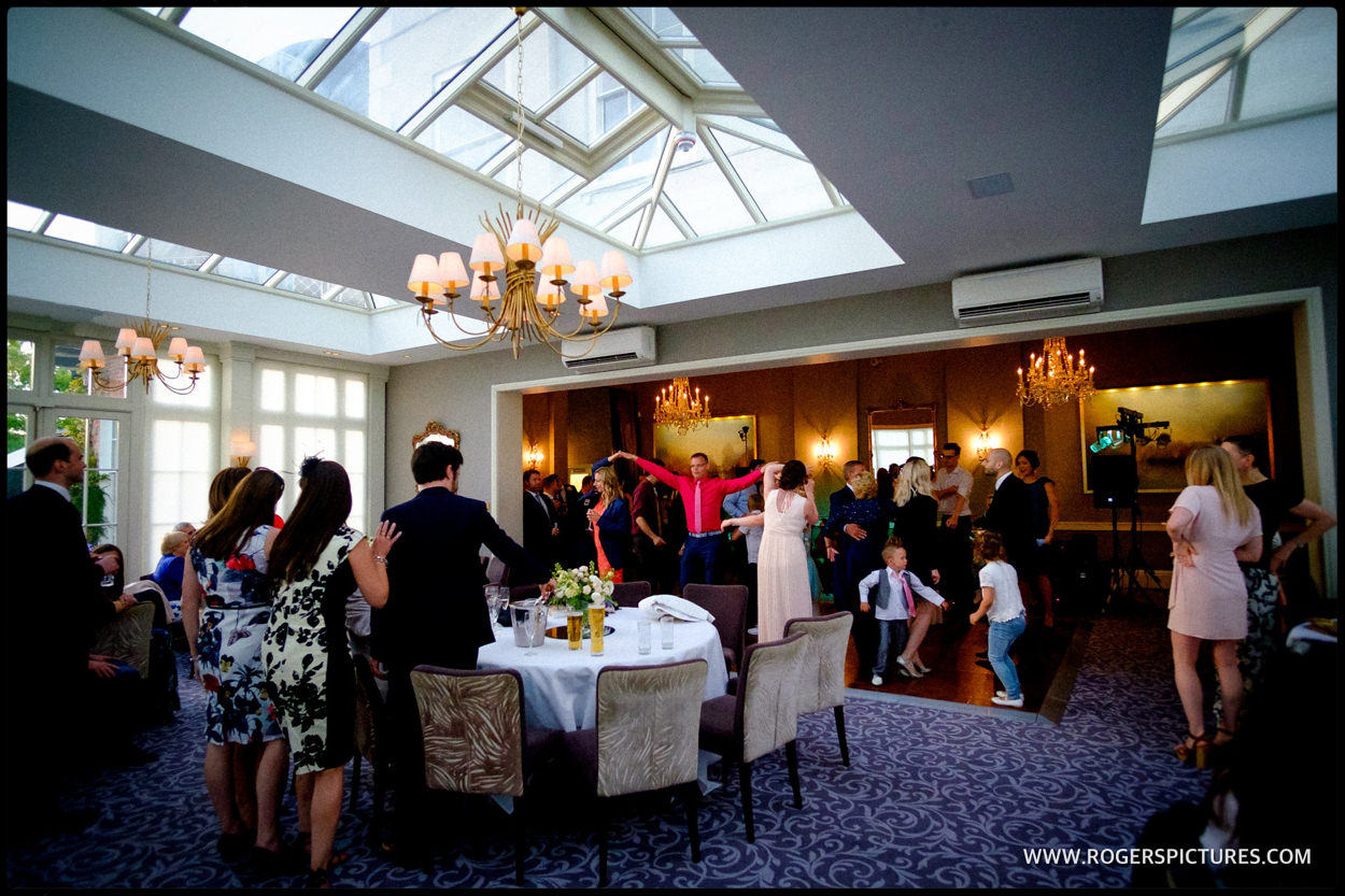 Wide shot of the dancefloor at a wedding at St Michael's Manor Hotel