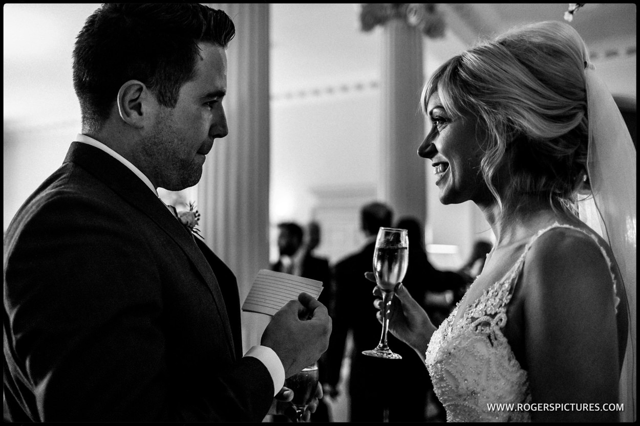 Man and wife with champagne after the wedding ceremony