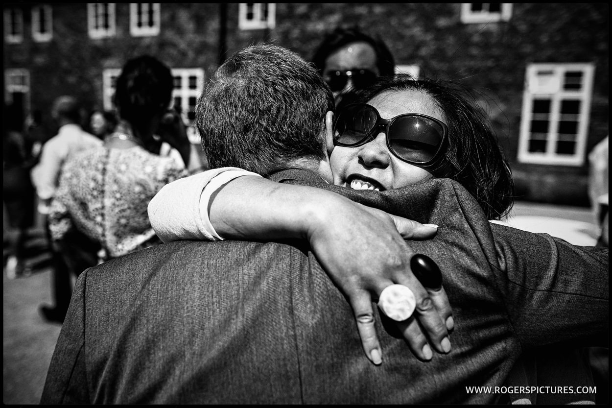 Guests hugging in the courtyard at Fulham Palace