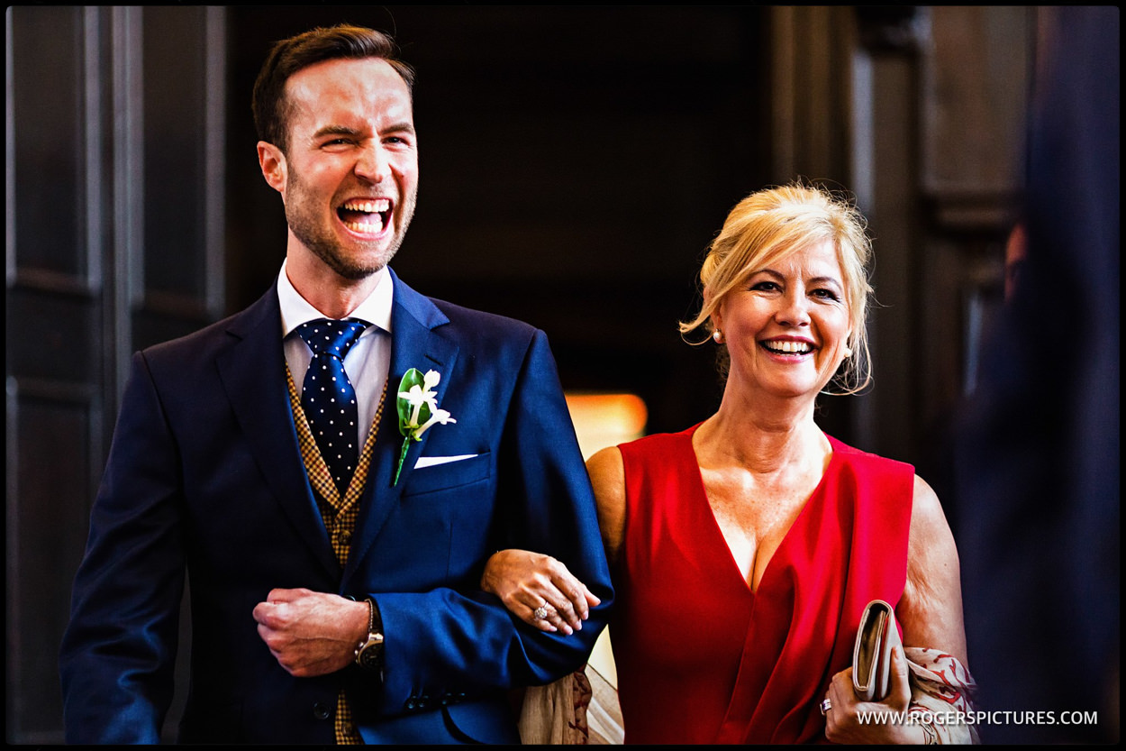 Laughing groom arrives for same-sex wedding at Fulham Palace