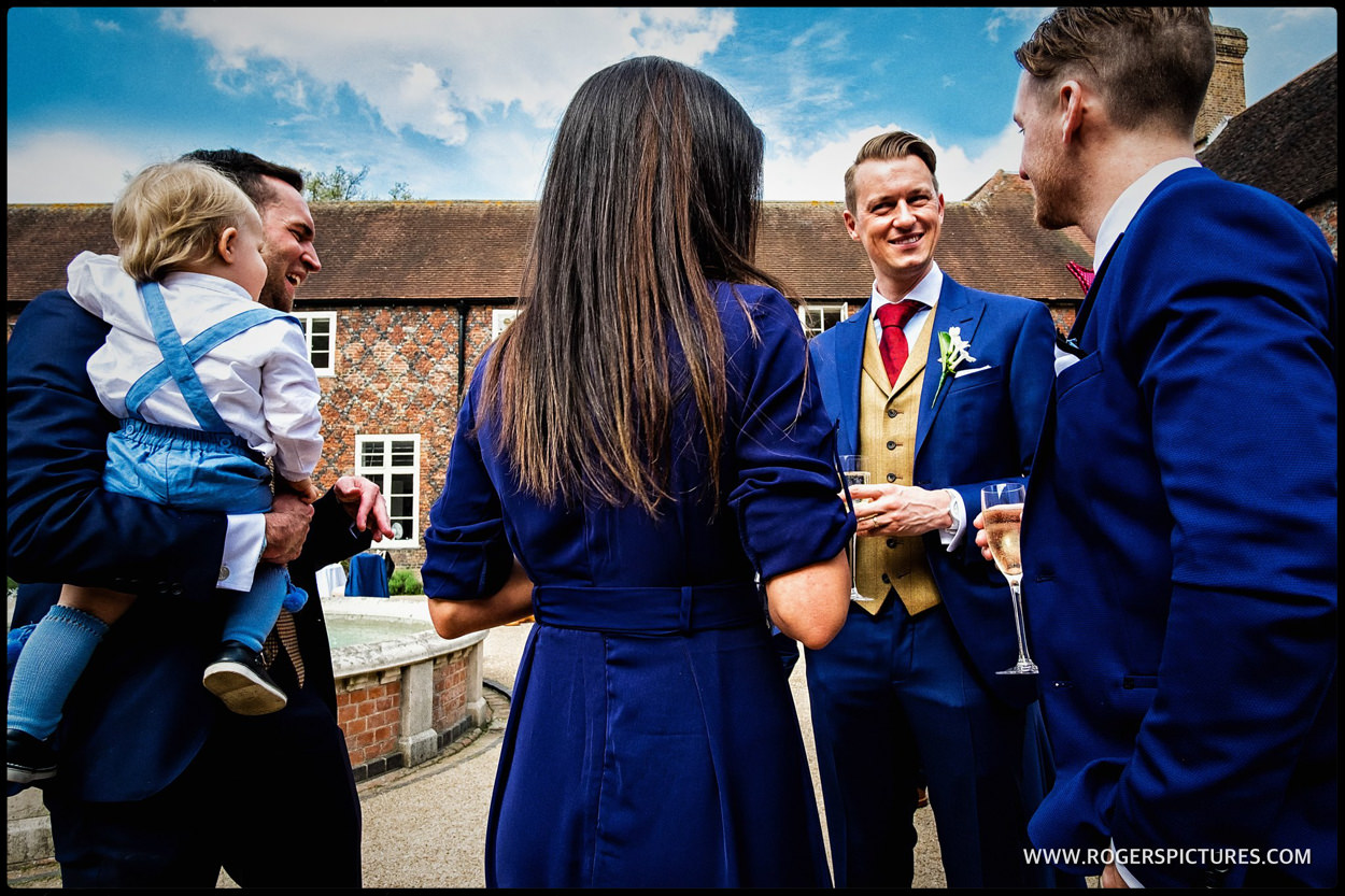 Guests in the courtyard at Fulham Palace wedding