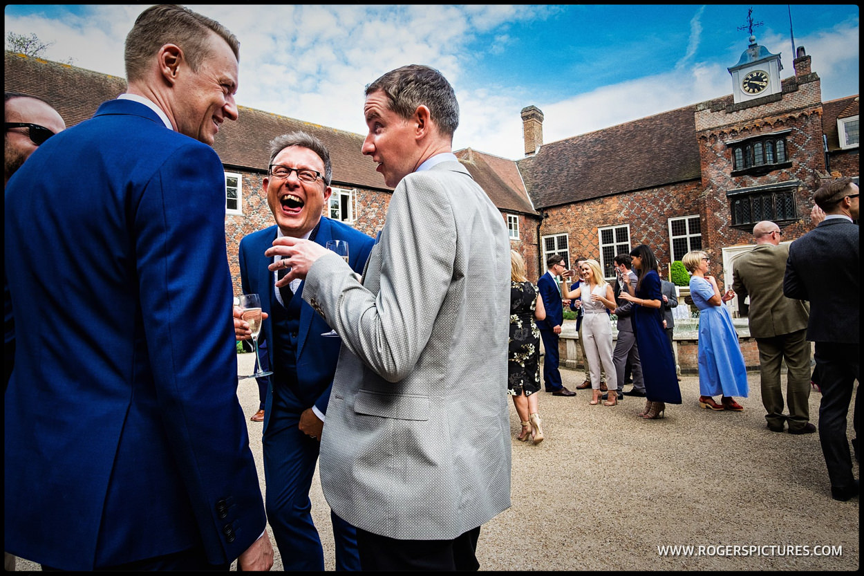 Guests enjoy jokes at Fulham Palace wedding