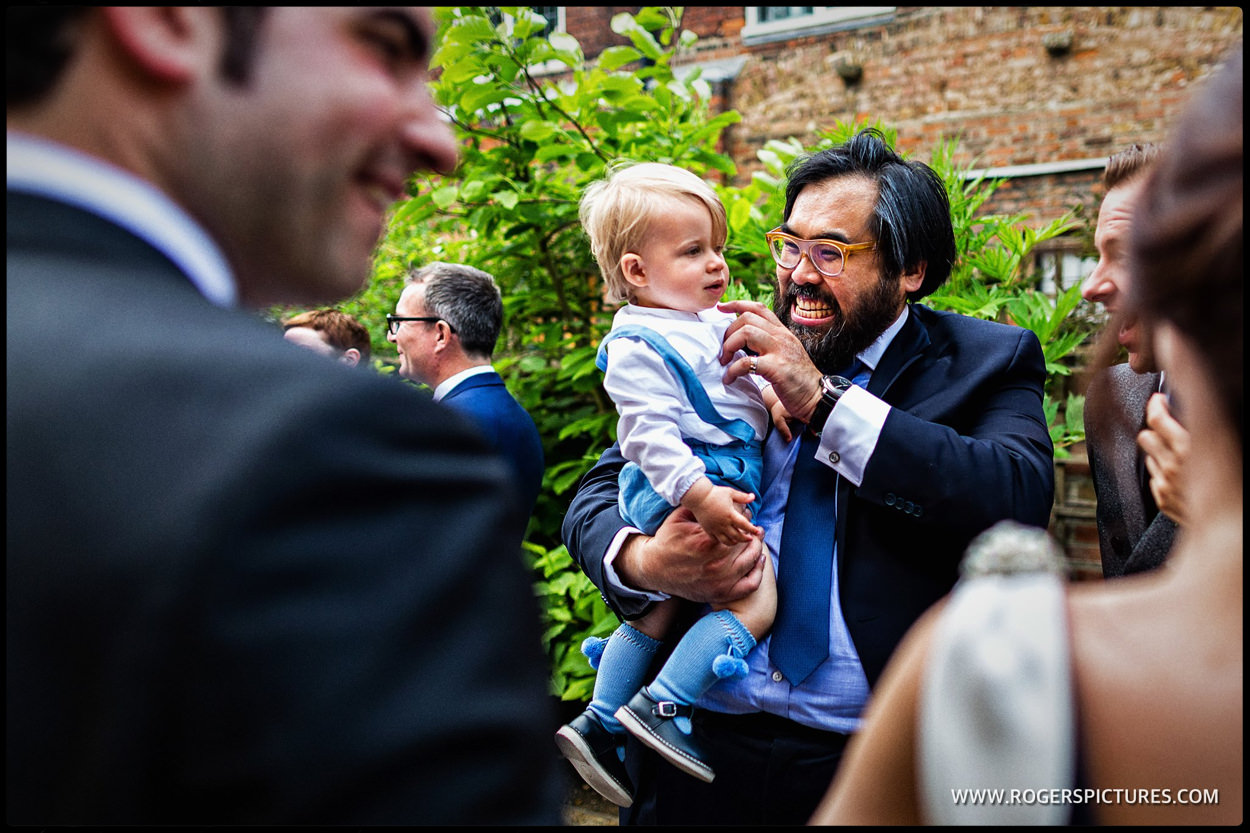 Wedding guest and child at London wedding