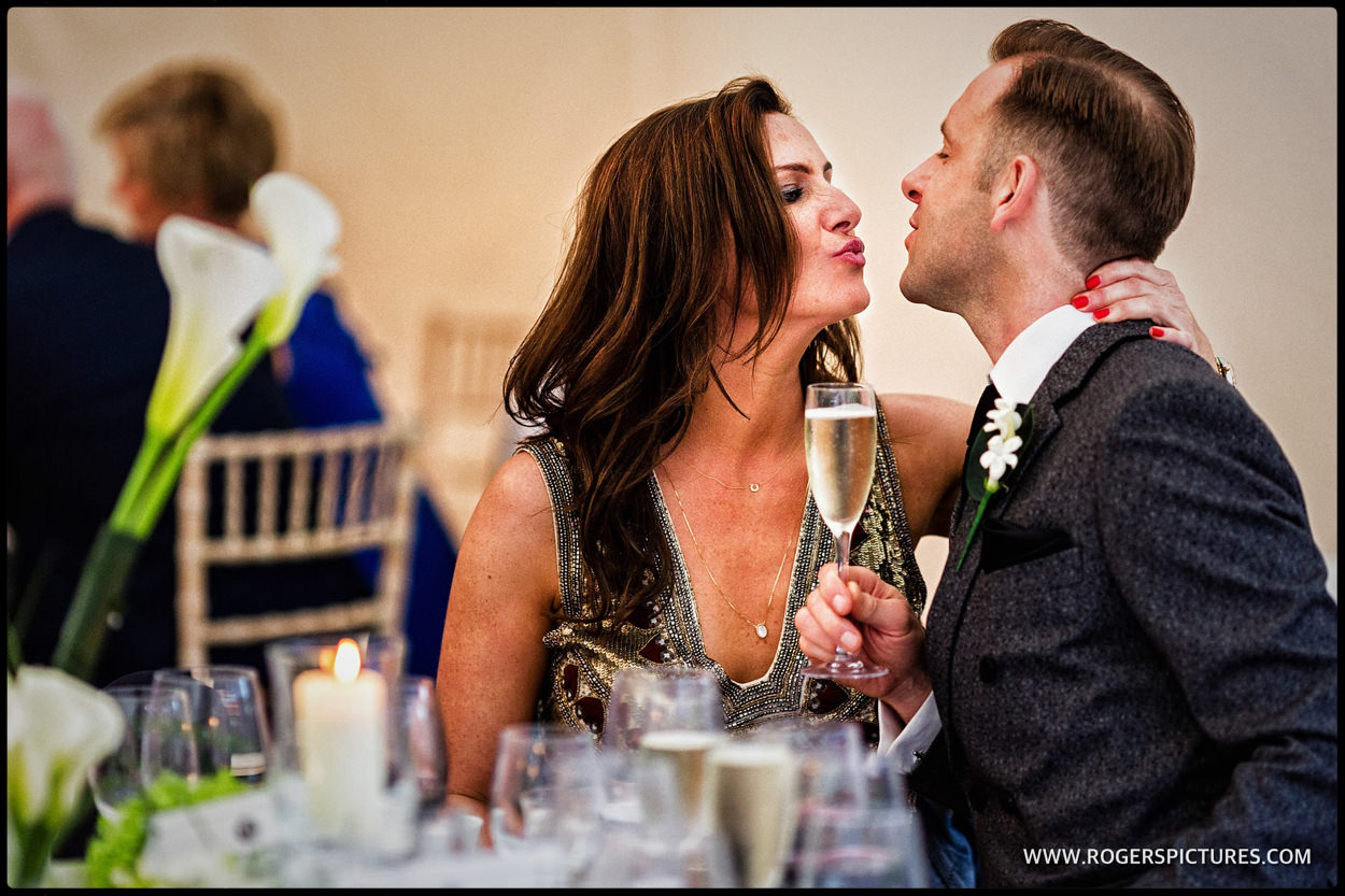 Happy wedding guests with champagne