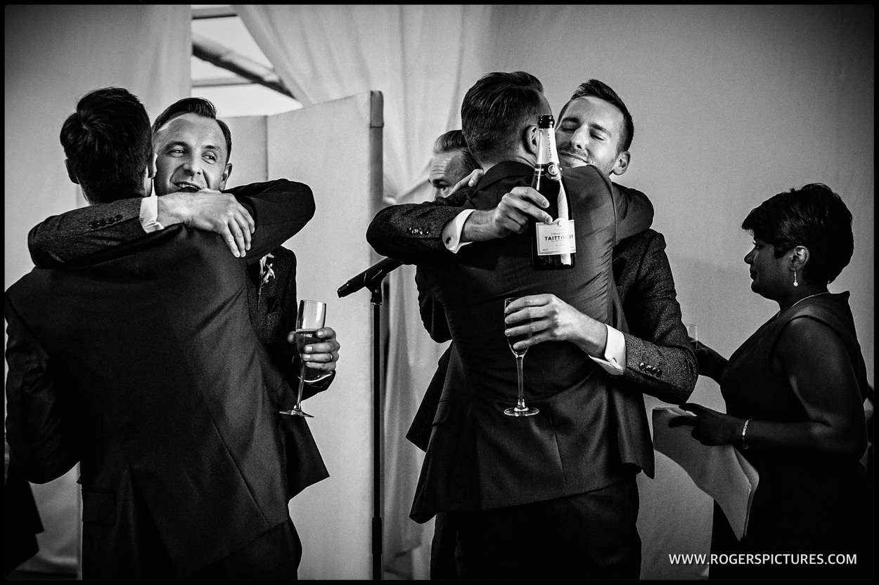 Hugs after wedding speeches at Fulham Palace in London