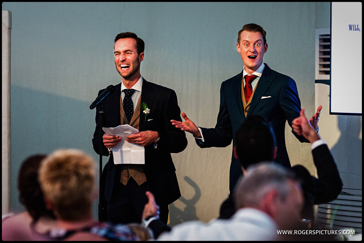 Grooms give a joint speech after wedding breakfast