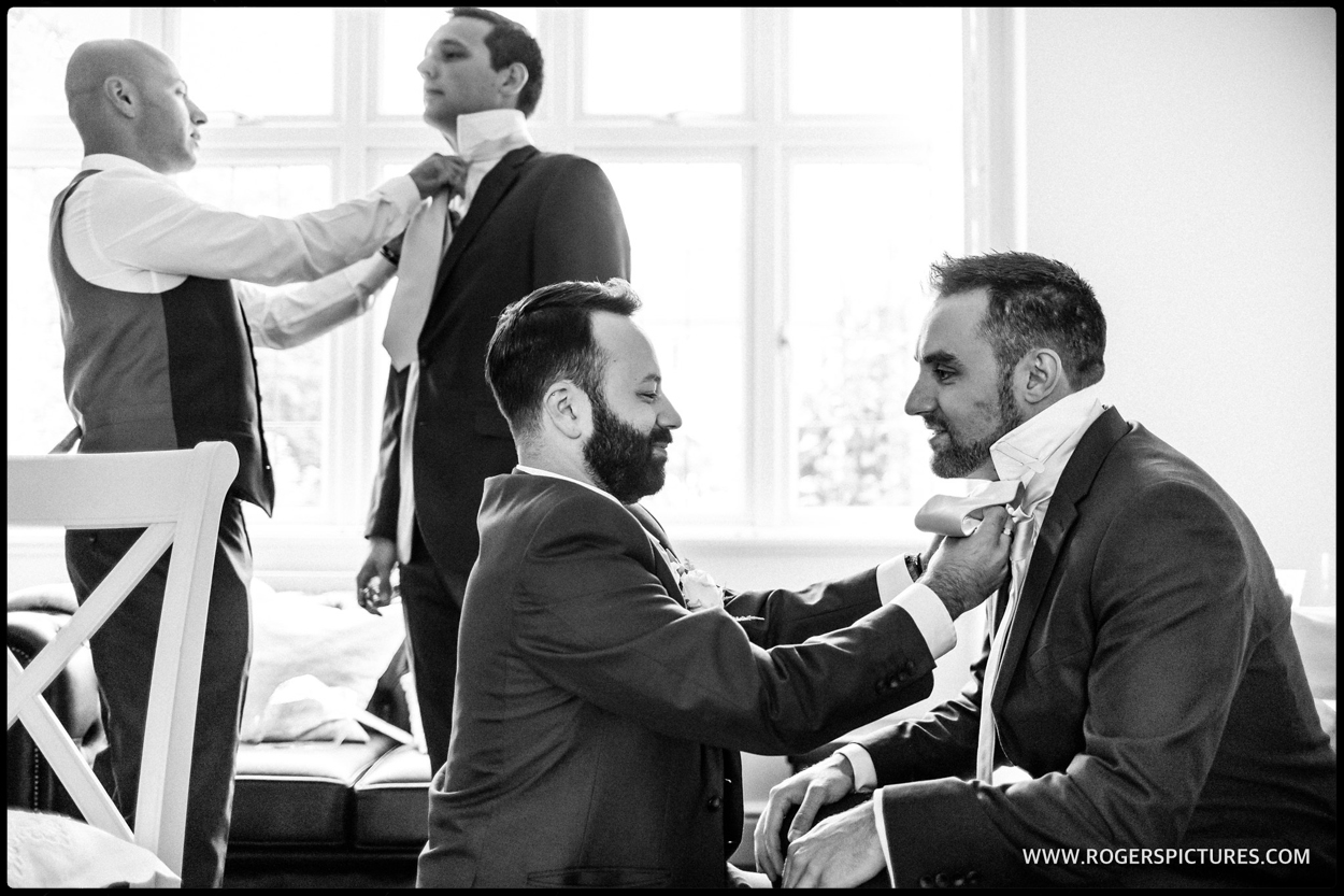 Groomsmen preparation before the Stolisma at a Greek Cypriot wedding