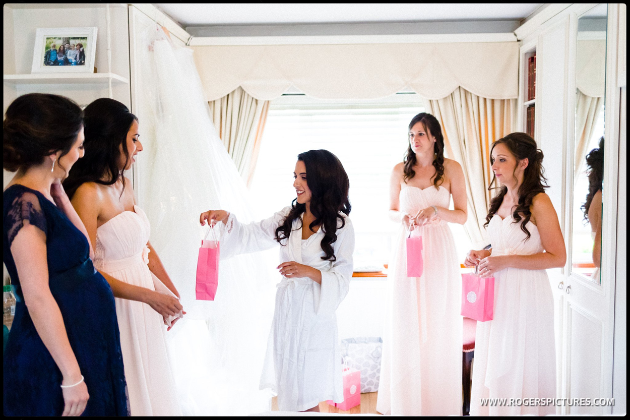 Bride and her mother prepare the wedding gown