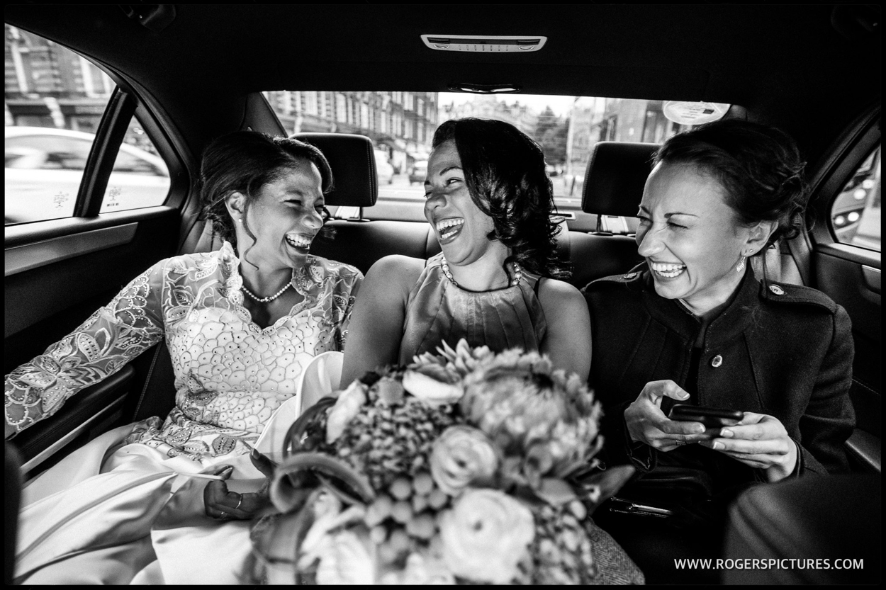 Bride and bridesmaids in an Uber on the way to Westminster wedding