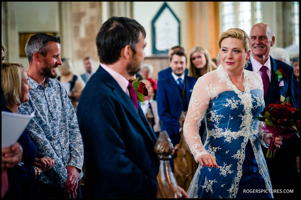 Groom sees bride at wedding ceremony