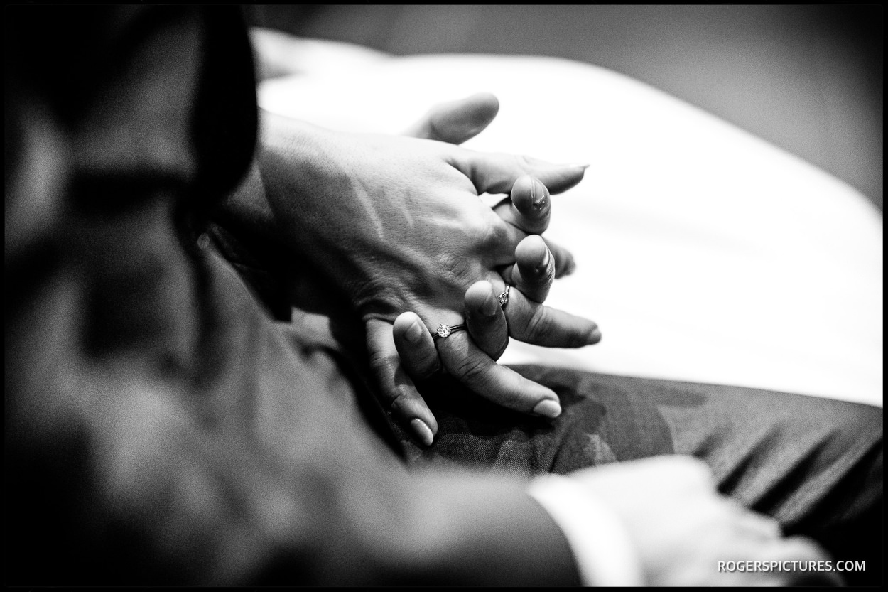 Couple holding hands during a church marriage