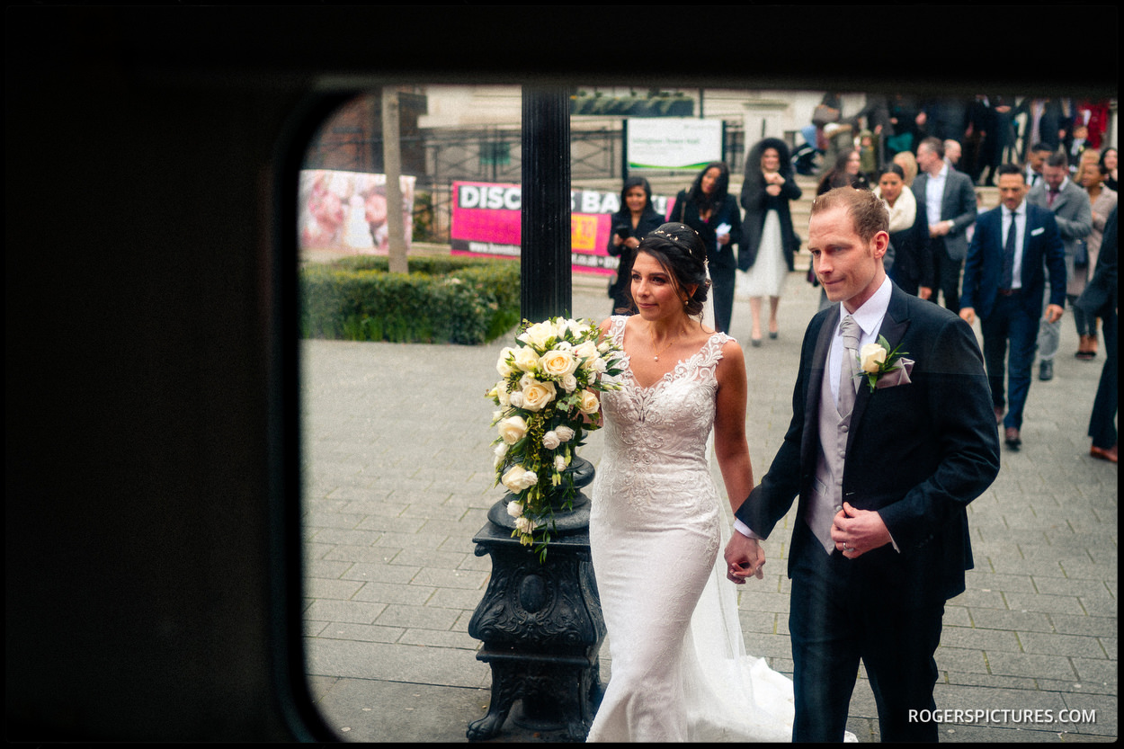 Bride and groom in North London board a wedding bus