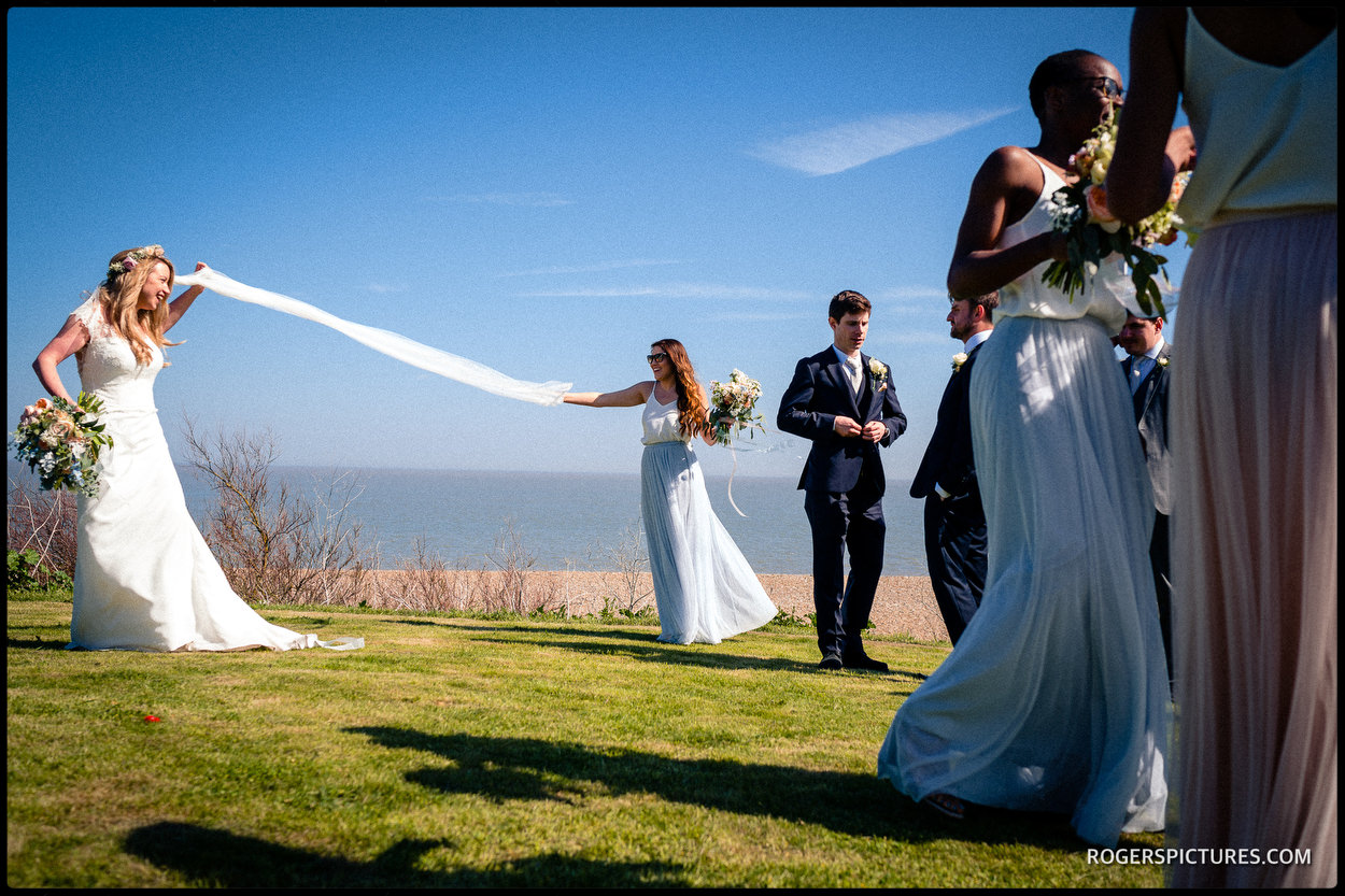Bride with veil blowing in the wind